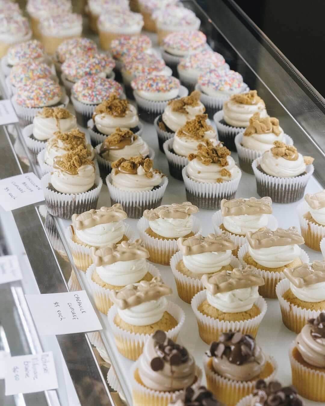 A selection of cupcakes in adisplay cabinet